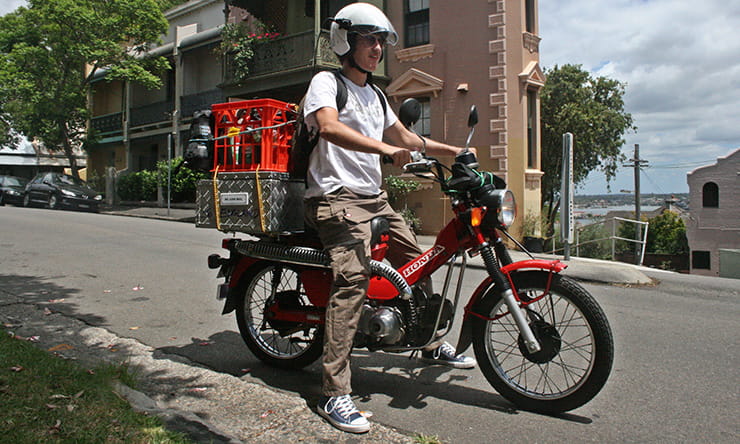 Nathan Millward on an Australian Post Office motorcycle